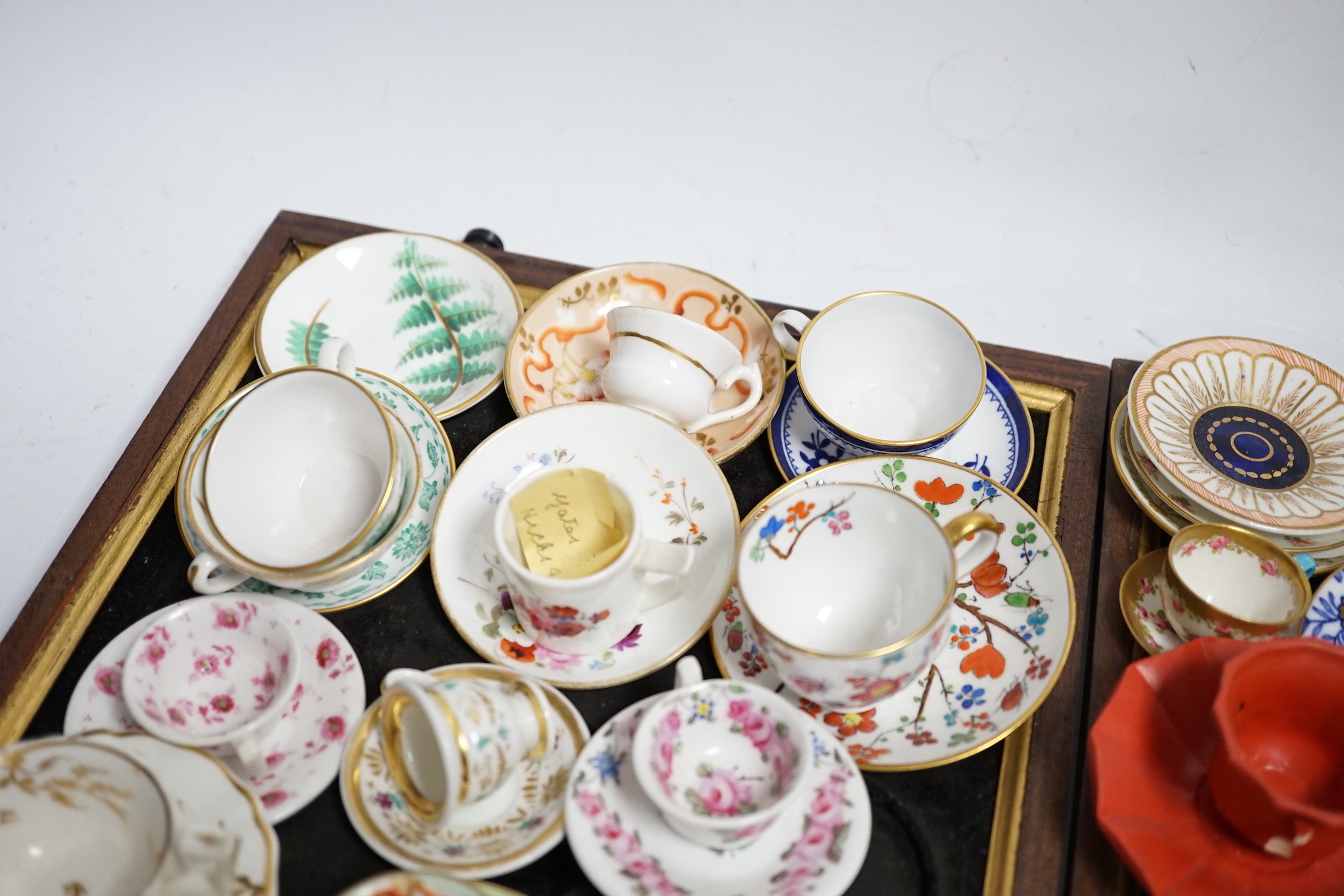 Collection of miniature porcelain cups and saucers including Spode, Royal Crown Derby and Coalport